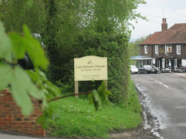 <The Larchmere House sign with the Bell and Jorrocks pub in the near distance>